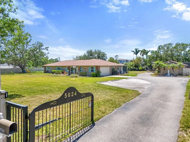 gated entry surrounded by privacy fence