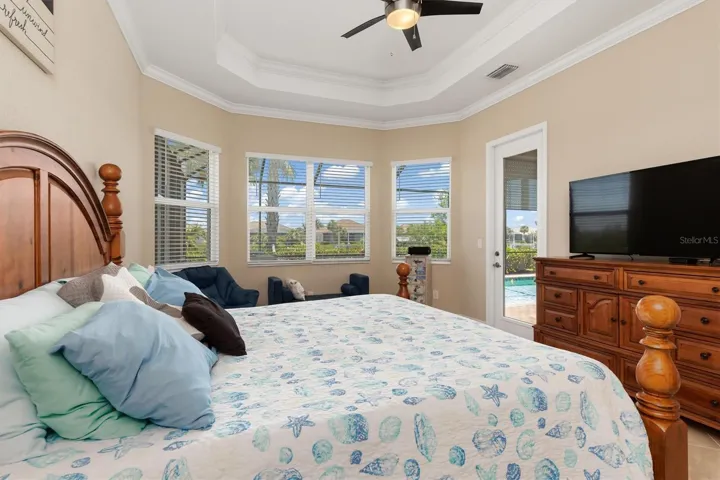 Bay windows overlook pool and canal.