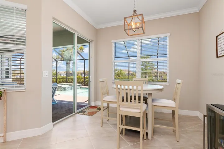 Dinette area with impact sliders to pool deck.