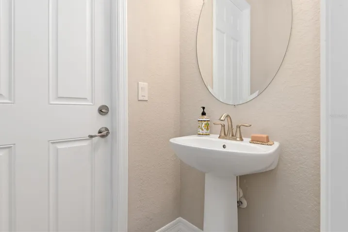 Half bath with door to pool.