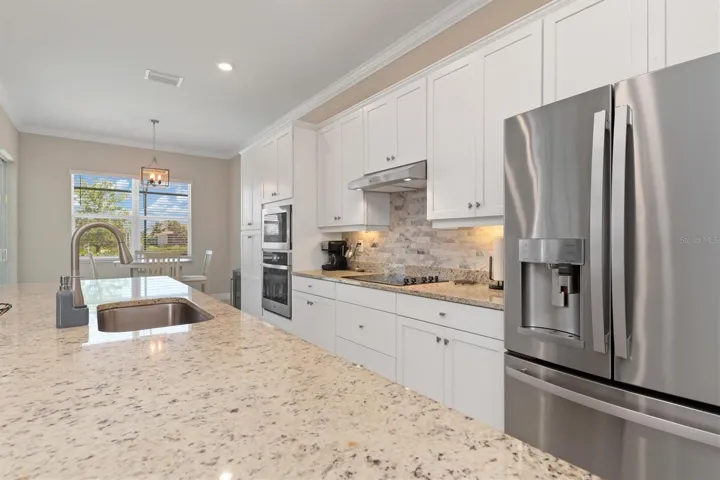 Stainless steel appliances and granite countertop.