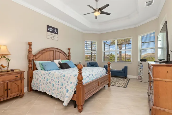 Master bedroom with trey ceiling and bay window.