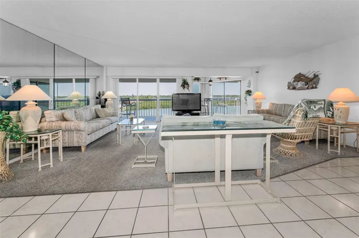 Expansive living room with open-concept layout seamlessly connecting to the 22' x 10' dining area and open kitchen, creating an airy, inviting space