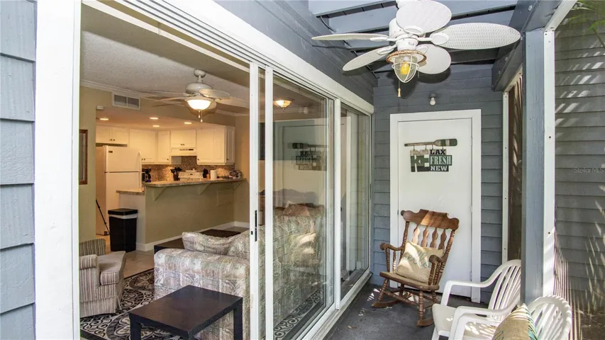 Porch area with storage closet