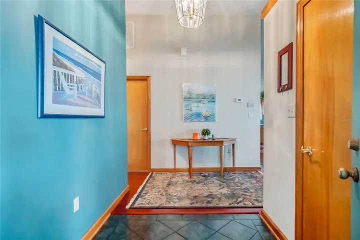 Foyer with Tile Flooring and Coat Closet