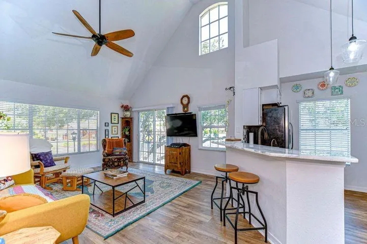 Your new living room has views of lake from the windows and vaulted ceiling.