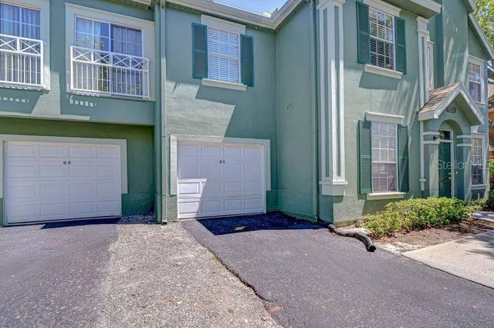 Deed Garage attached to building 16 with parking space in front of it