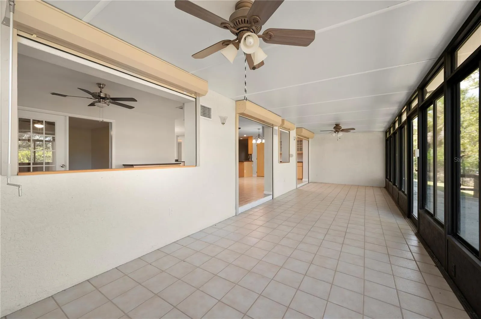 Sun Room (Florida Room) has hurricane shutters.
