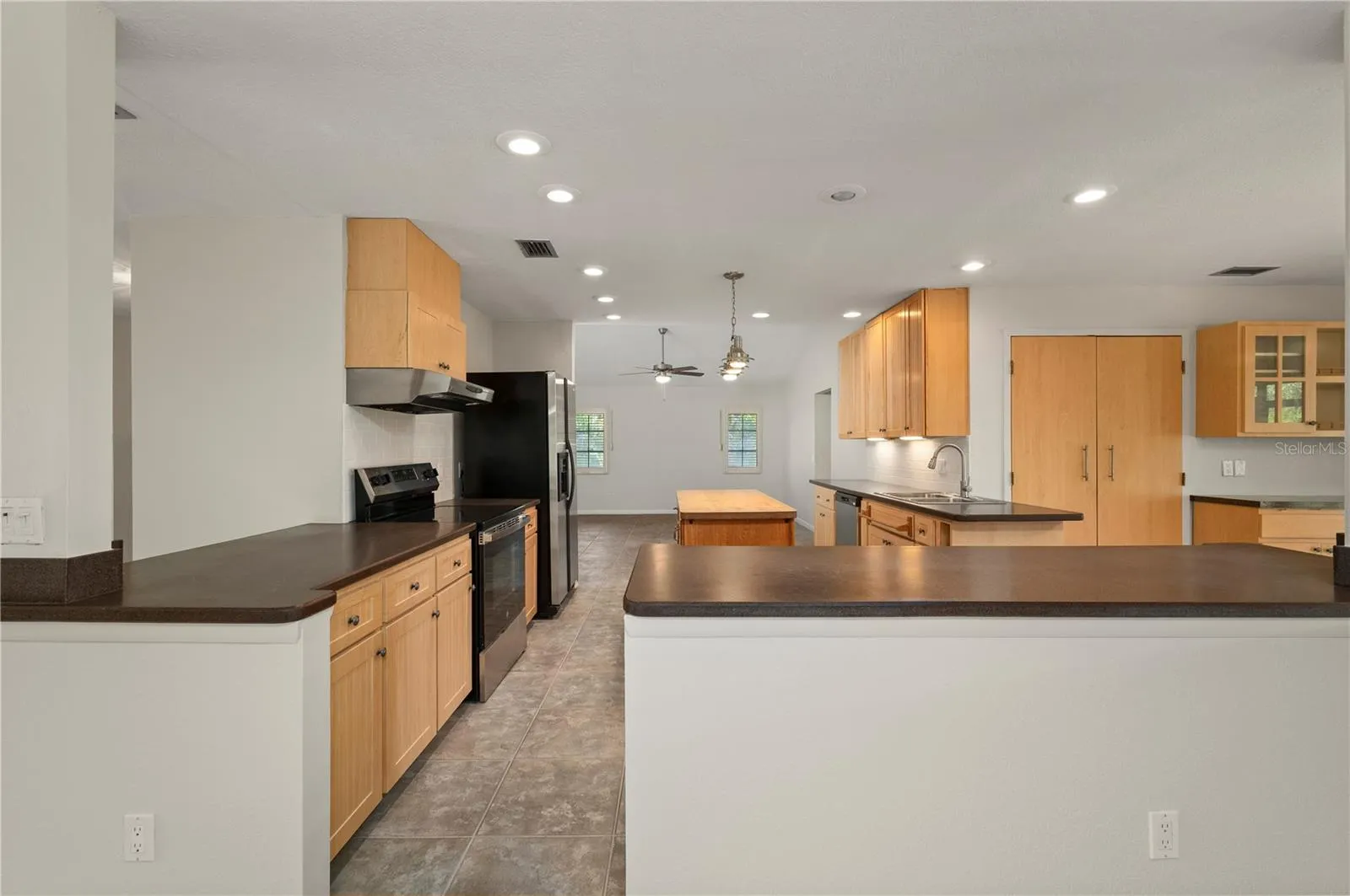 View of the kitchen from the dining area and entry to the Family Room