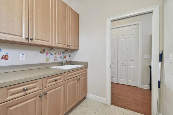 Door to Hallway with Pantry Closet on the other side.