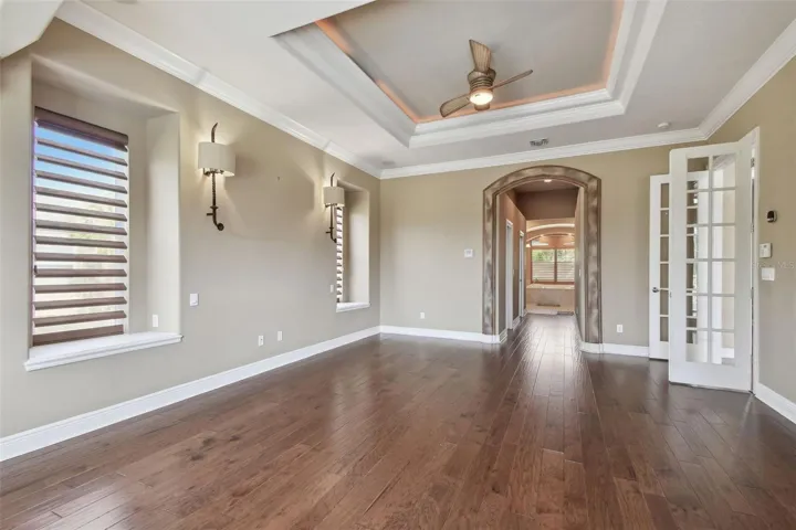 Perspective of the primary bedroom from the sitting area.