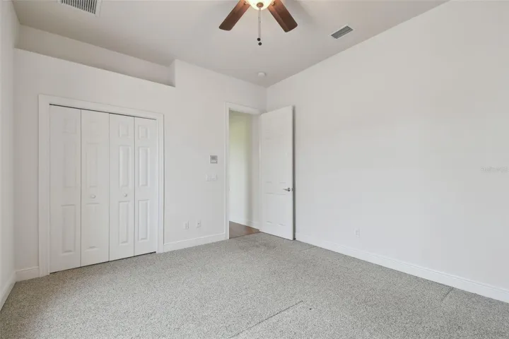 Bedroom Three with plant shelve.