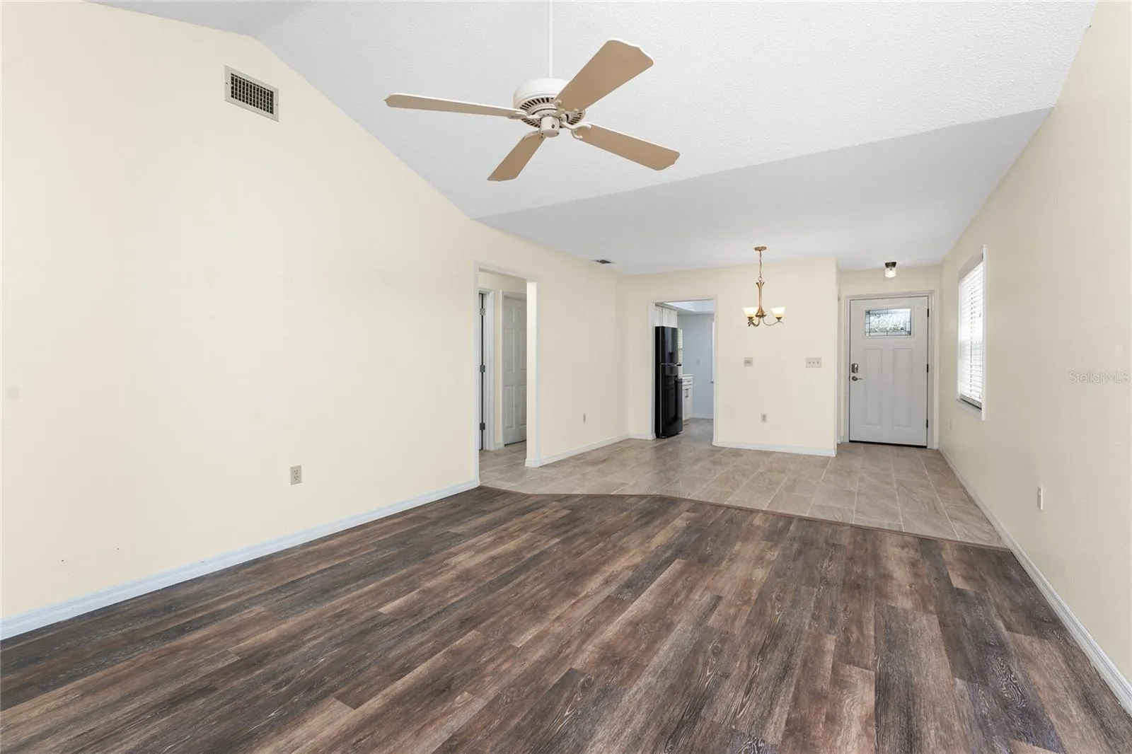 Main living area has updated laminate flooring.