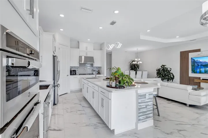 GE Built ins and Large Island in the Chef's Kitchen