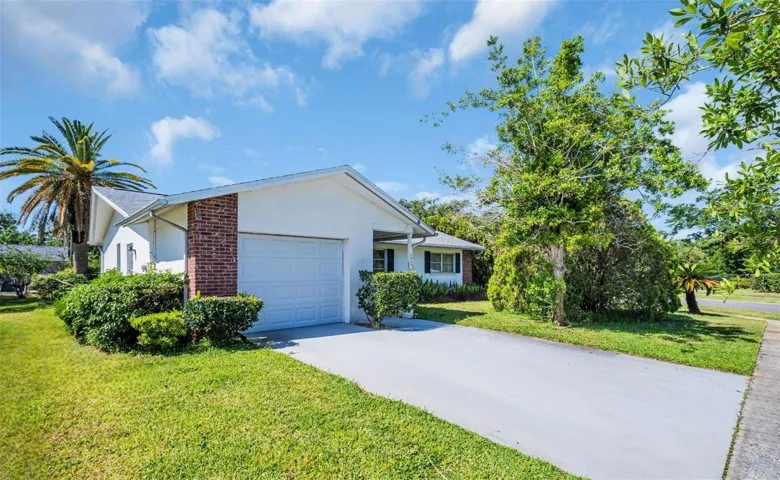 Welcome home! Updated garage door & recently widened driveway~