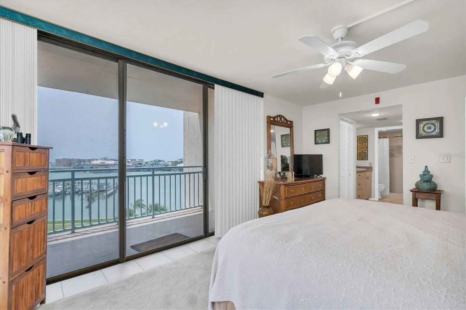 Master Br - views of Johns Pass from your bed! FLOOR TO CEILING GLASS