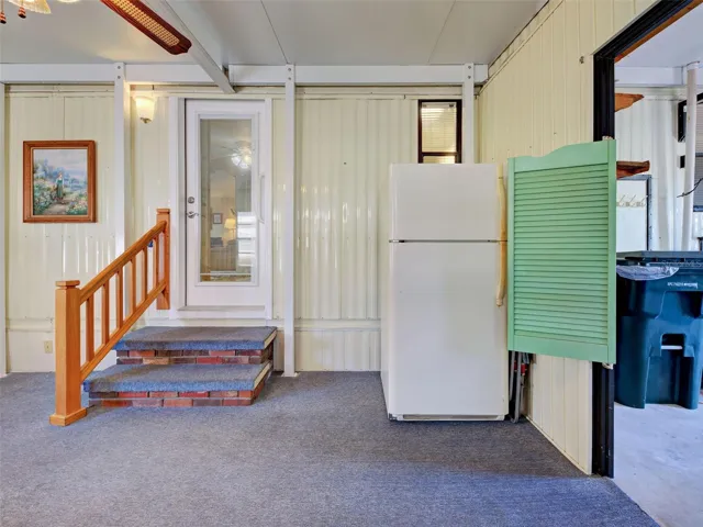 ENCLOSED PORCH - UNDER ROOF- COULD SET THIS UP AS AN ADDITIONAL SITTING AREA