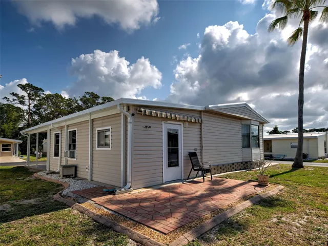 EXTERIOR REAR - BBQ AREA WITH RETRACTABLE AWNING