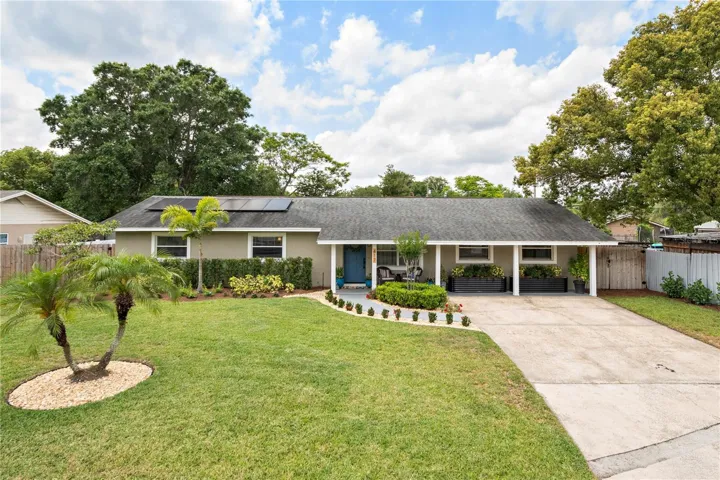 Meticulously maintained modern mid century home.  Solar panels visible on roof.