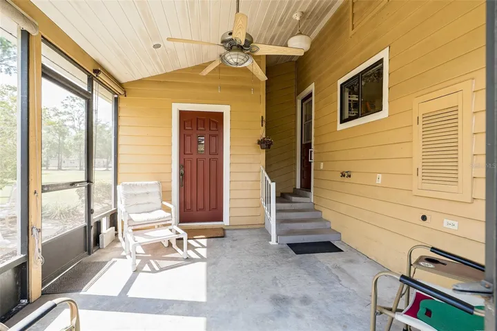 Screened Covered Back lanai has an access point into the Sunken Living room and a back door entering directly into the kitchen.