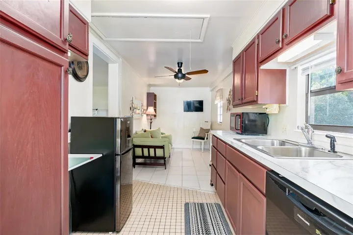 Full view of the apartment kitchen and living spaces. FULLY RENOVATED with NEW cabinets, Updated electric lines , plumbing, Dishwasher.