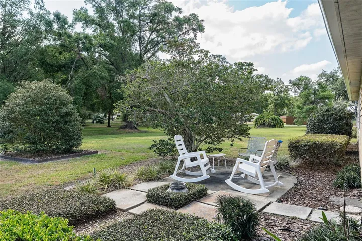 Backyard view of the OPEN PATIO & Gardens.