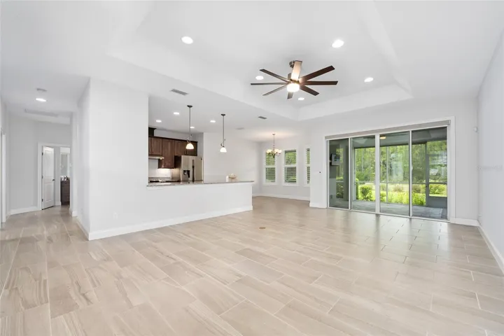 Open living space with tile seamlessly flowing throughout
