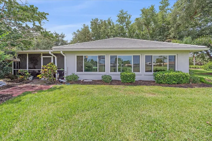 Back of house w/ Florida Room & Lanai Facing Golf Course