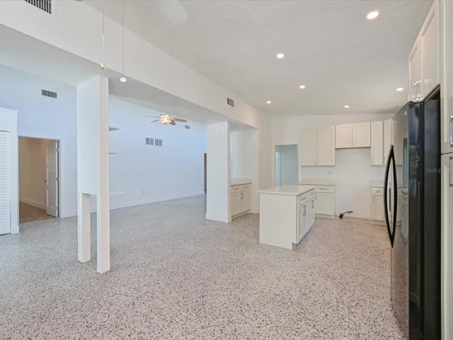 Dining area view of kitchen and foyer