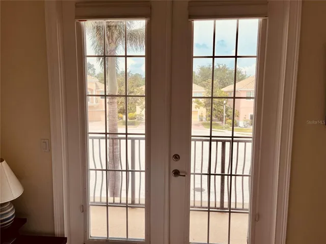 French door to the private front balcony