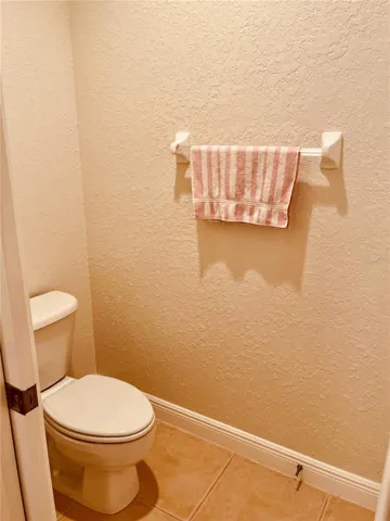 Water closet behind pocket door