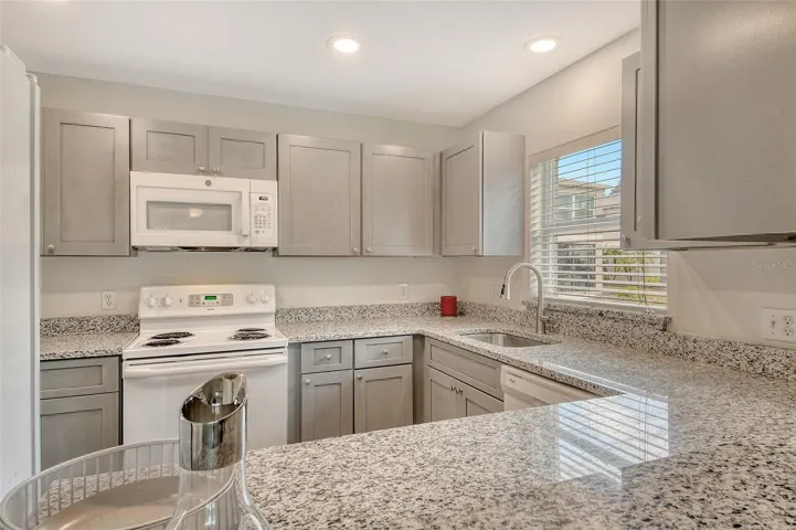 Updated kitchen with new cabinetry and stone counters