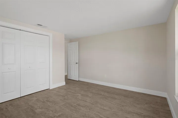 Larger bedroom faces the front of the house.