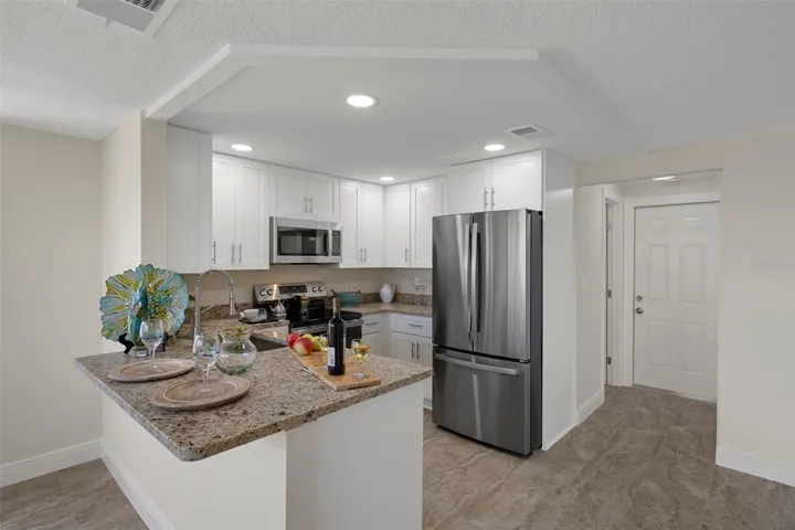 Perfect kitchen location - center of the entire house - great entertaining large groups.