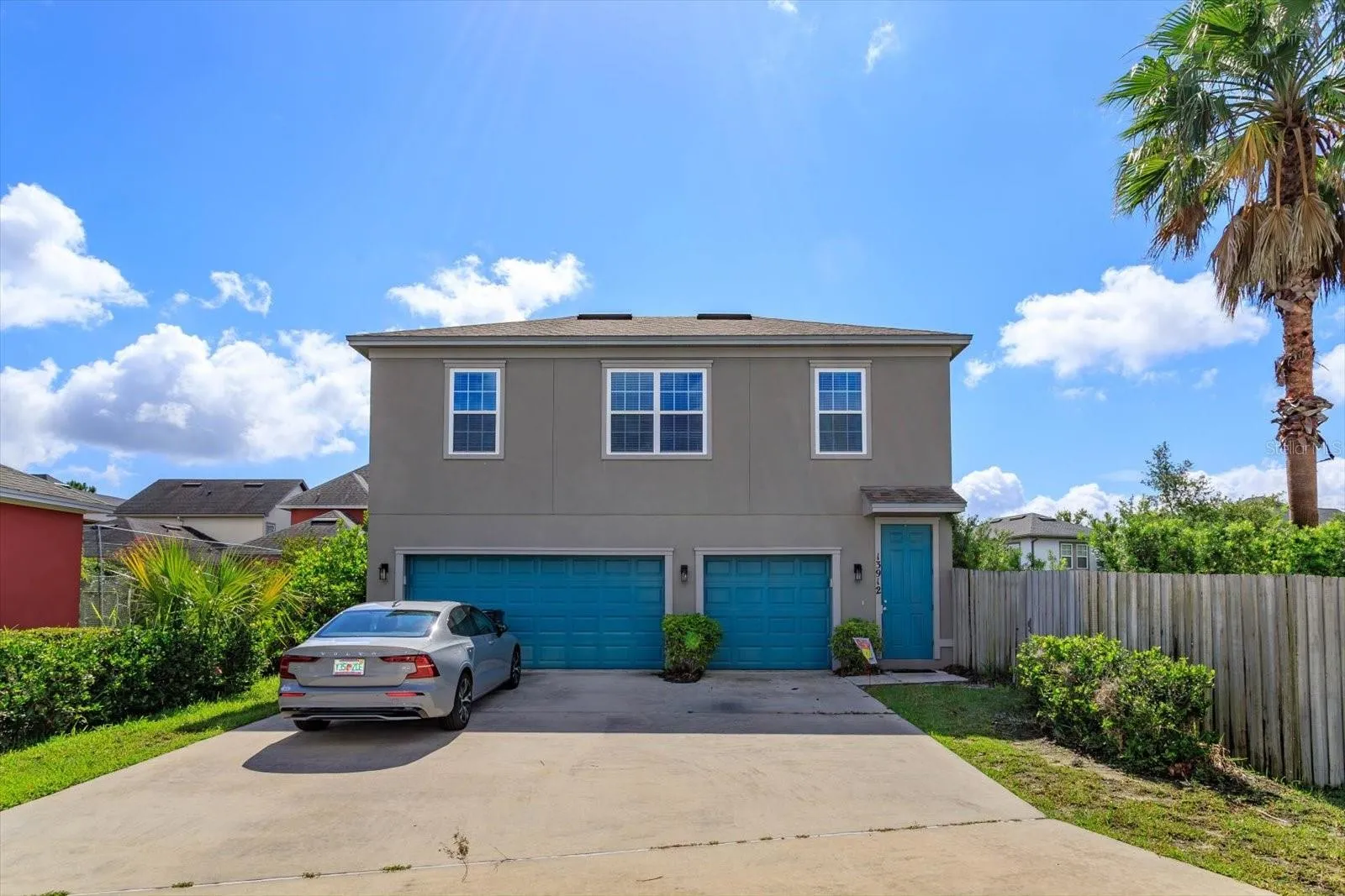 Entrance that includes space for 1 car on driveway plus access and room for 1 car in the garage.