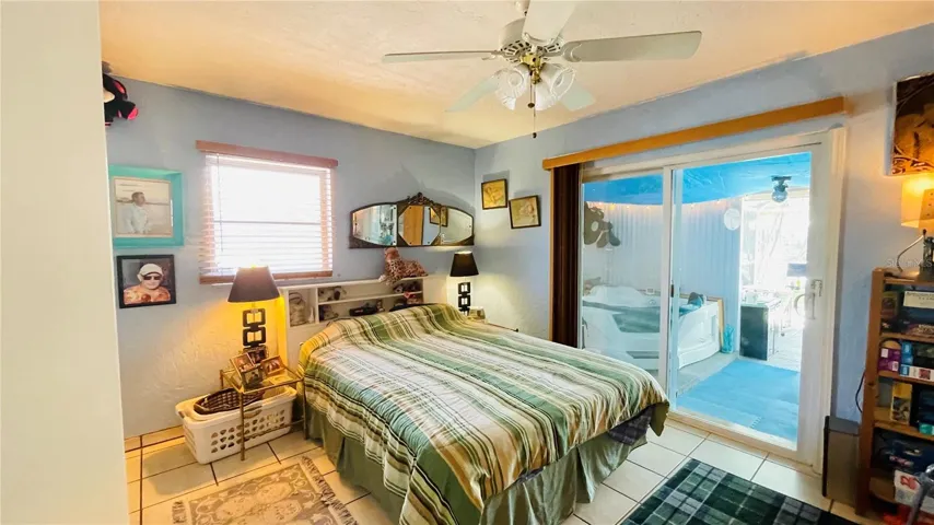 Primary bedroom with exterior sliding doors
