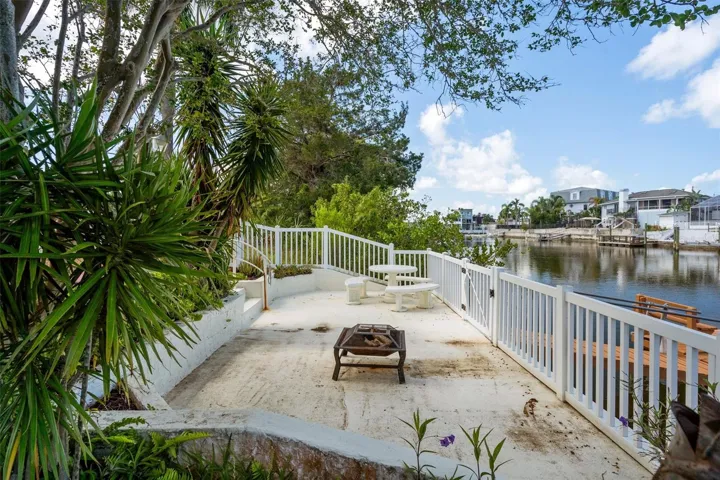 Outdoor space perfect for entertaining or unwinding by the water.