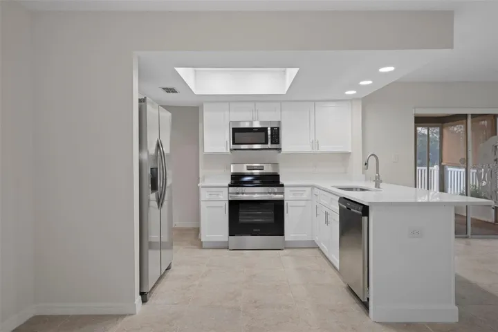 Updated kitchen with shaker cabinetry and clean, modern finishes.