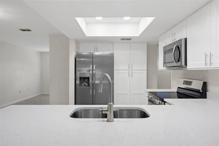 Extended breakfast bar offers additional seating and prep space.
