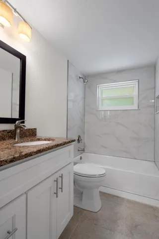 Clean and updated guest bathroom.