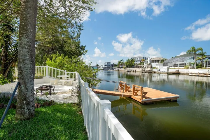 private seawall and floating dock with quick access to open water
