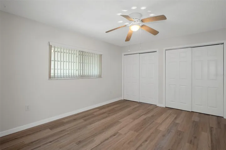Primary Bed: Spacious layout with natural light and updated flooring.