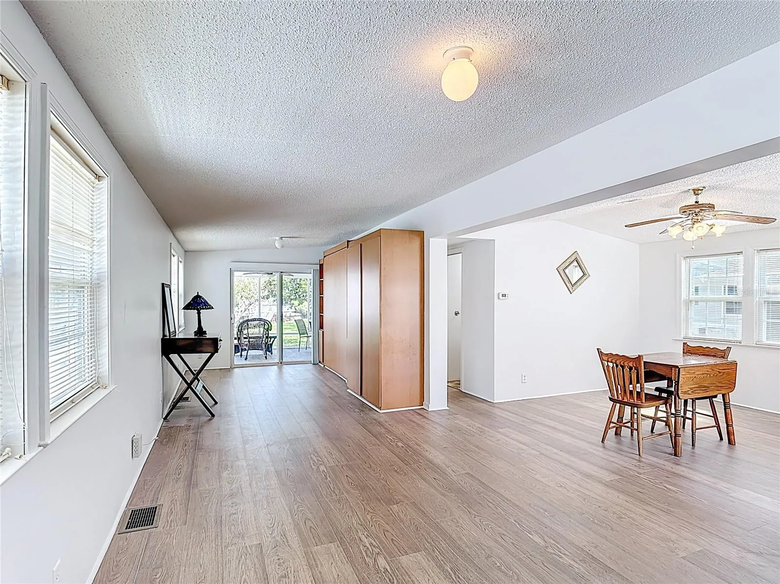 Spacious family room with newly install vinyl plank flooring