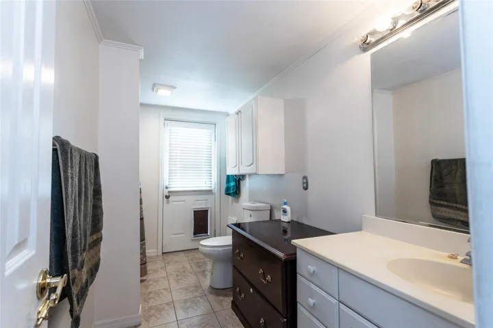 Main floor bathroom leading to backyard.