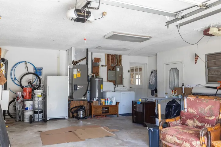 Garage that leads to the in-law suit with additional door off the driveway.