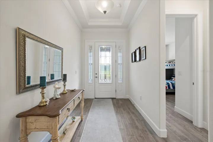 Front entry view into first bedroom