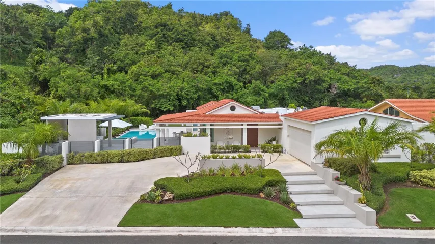 This exceptional single-story residence is situated on a premium corner lot of 1,161 square meters, offering sweeping mountain views and abundant space.
