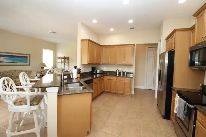Kitchen with nice size Breakfast Bar...