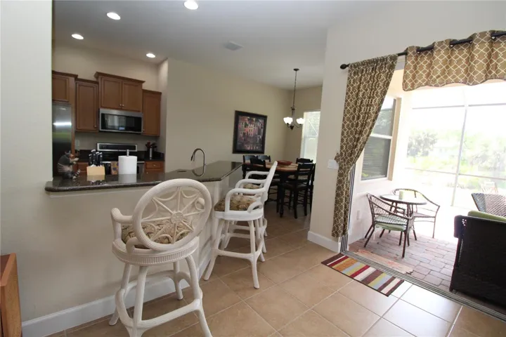 Sliding glass door out to your private screened covered lanai...