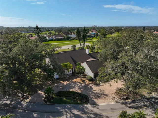 Spacious property with paver driveway and golf course view